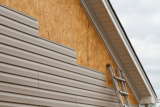 Professional Storm Damage Siding Repair technician working in Spangler, PA